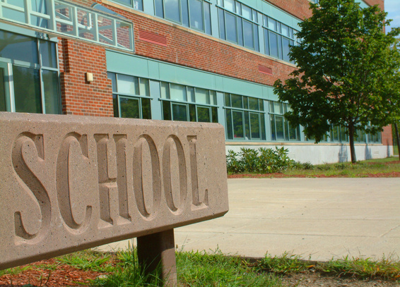 Large School sign in front of school building