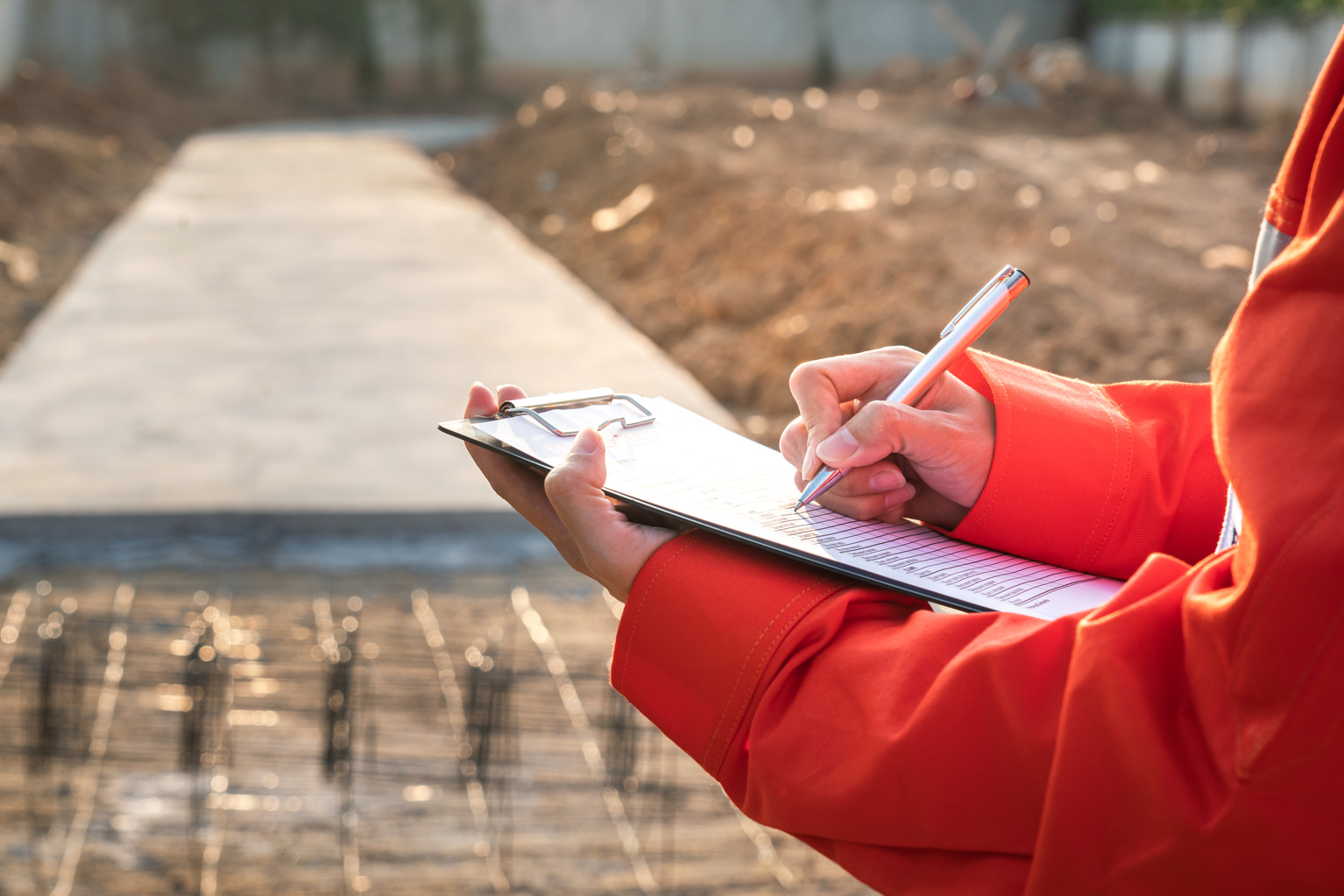 An engineer is inspection the construciton working site.